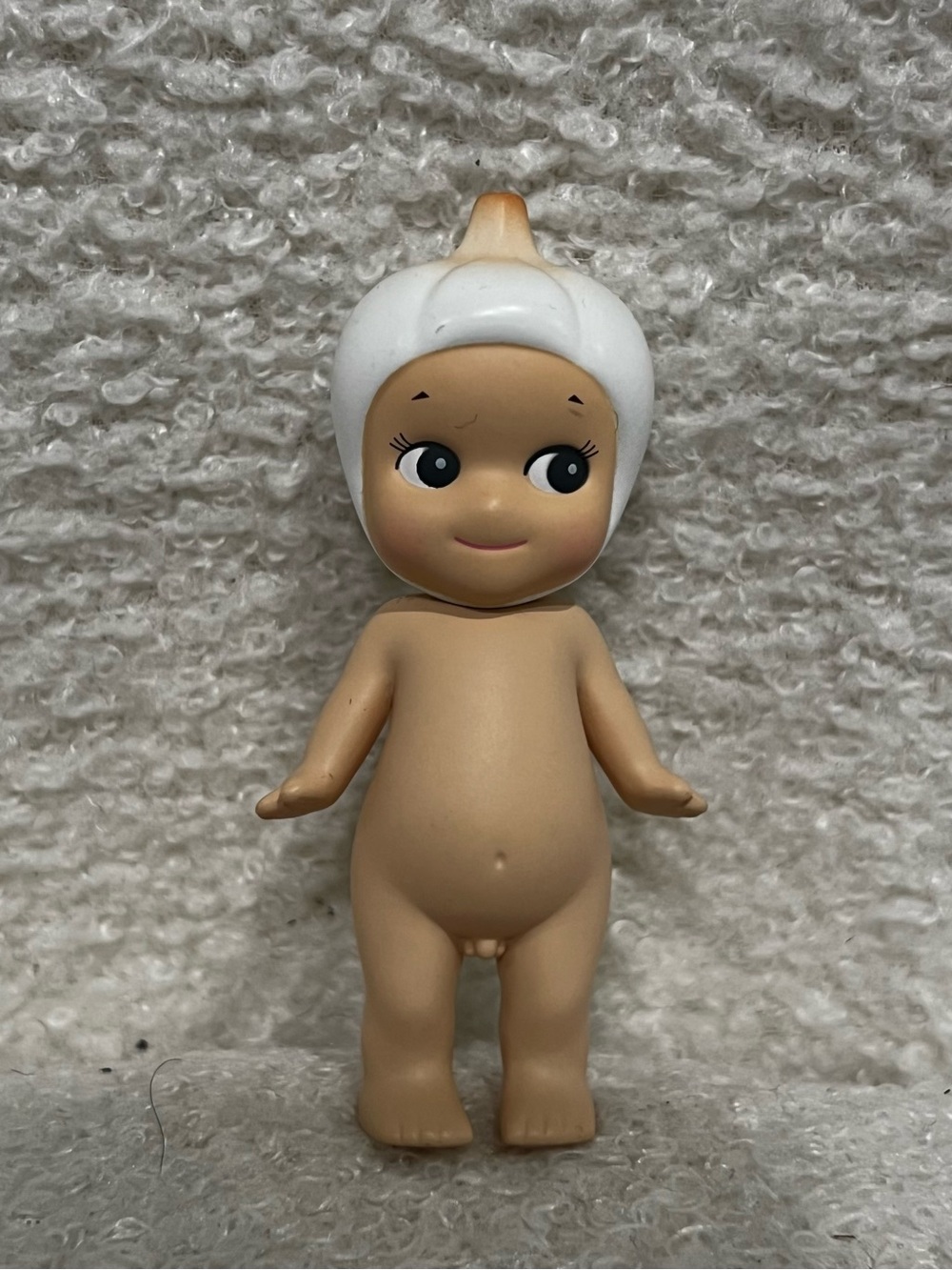 Classic Beige Baby Doll Figure with White Cap